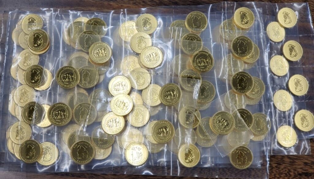 gold coins in packaging on table